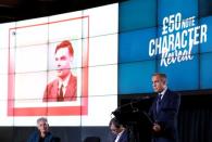 Bank of England governor Mark Carney presents the image of mathematician Alan Turing who will appear on a new 50 pound note at at the Science and Industry Museum in Manchester