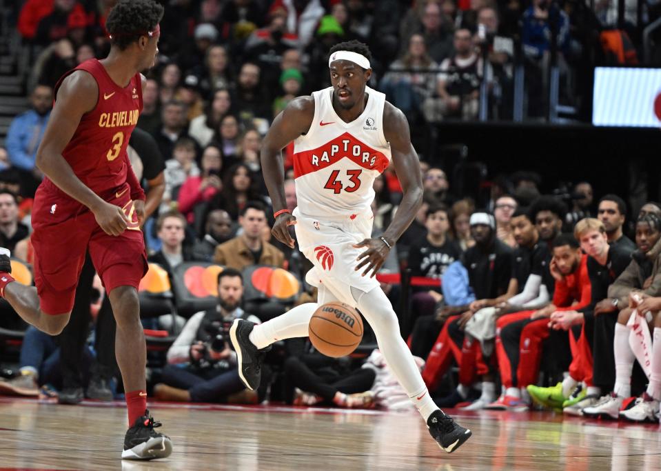 Toronto Raptors forward Pascal Siakam (43) dribbles the ball as Cleveland Cavaliers guard Caris LaVert (3) defends at Scotiabank Arena.