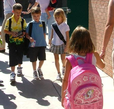 Sawyer Bland's first day of kindergarten was made easier by the support of his two worldly second-grade friends, Lucas Henderson and Andi Blodgett, both 7.