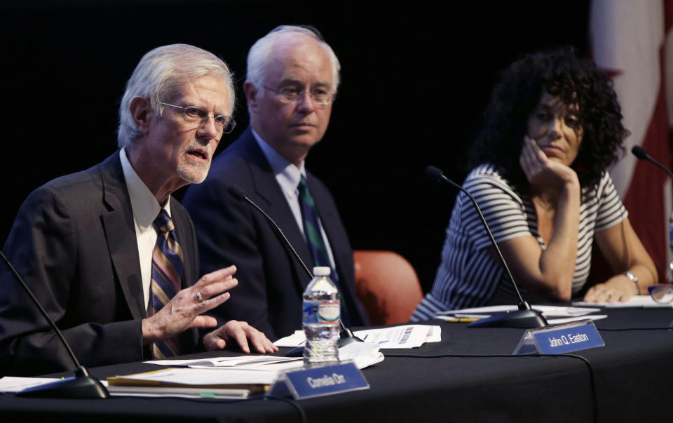 From left, John Easton, Director of the Institute of Education Sciences and Acting Commissioner of the National Center for Education Statistics, Dale Nowlin, a 12th-grade mathematics teacher at Bartholomew Consolidated School Corporative in Columbus, Ind., and Susan Pimentel an educational consultant and curriculum specialist and Vice Chair of the National Assessment Governing Board participate in a program at Dunbar High School, Wednesday, May 7, 2014, in Washington, to announce results of The Nation's Report Card: 2013 Mathematics and Reading, Grade 12, which details 12th graders' performance in mathematics and reading nationwide and in 13 pilot states. In an abysmal showing, only about one-quarter of U.S. high school seniors performed solidly in math in a major assessment known as the nation's report card, reinforcing concerns that large numbers of students are unprepared for either college or the workplace. (AP Photo/Carolyn Kaster)