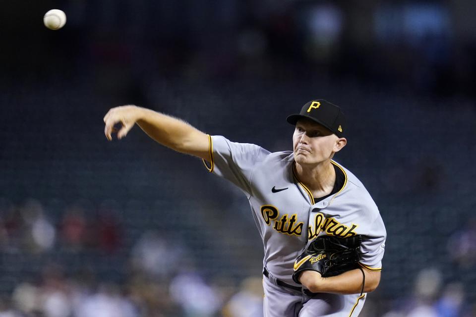 Pittsburgh Pirates starting pitcher Mitch Keller throws a pitch to an Arizona Diamondbacks batter during the first inning of a baseball game Wednesday, Aug. 10, 2022, in Phoenix. (AP Photo/Ross D. Franklin)