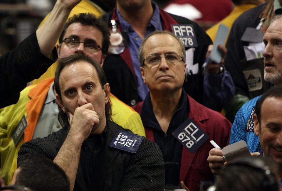 Traders in Chicago watch stock index futures plunge on March 17, 2008. <a href="https://www.gettyimages.com/detail/news-photo/traders-watch-prices-in-the-s-p-500-stock-index-futures-pit-news-photo/80276991" rel="nofollow noopener" target="_blank" data-ylk="slk:Scott Olson/Getty Image;elm:context_link;itc:0;sec:content-canvas" class="link ">Scott Olson/Getty Image</a>