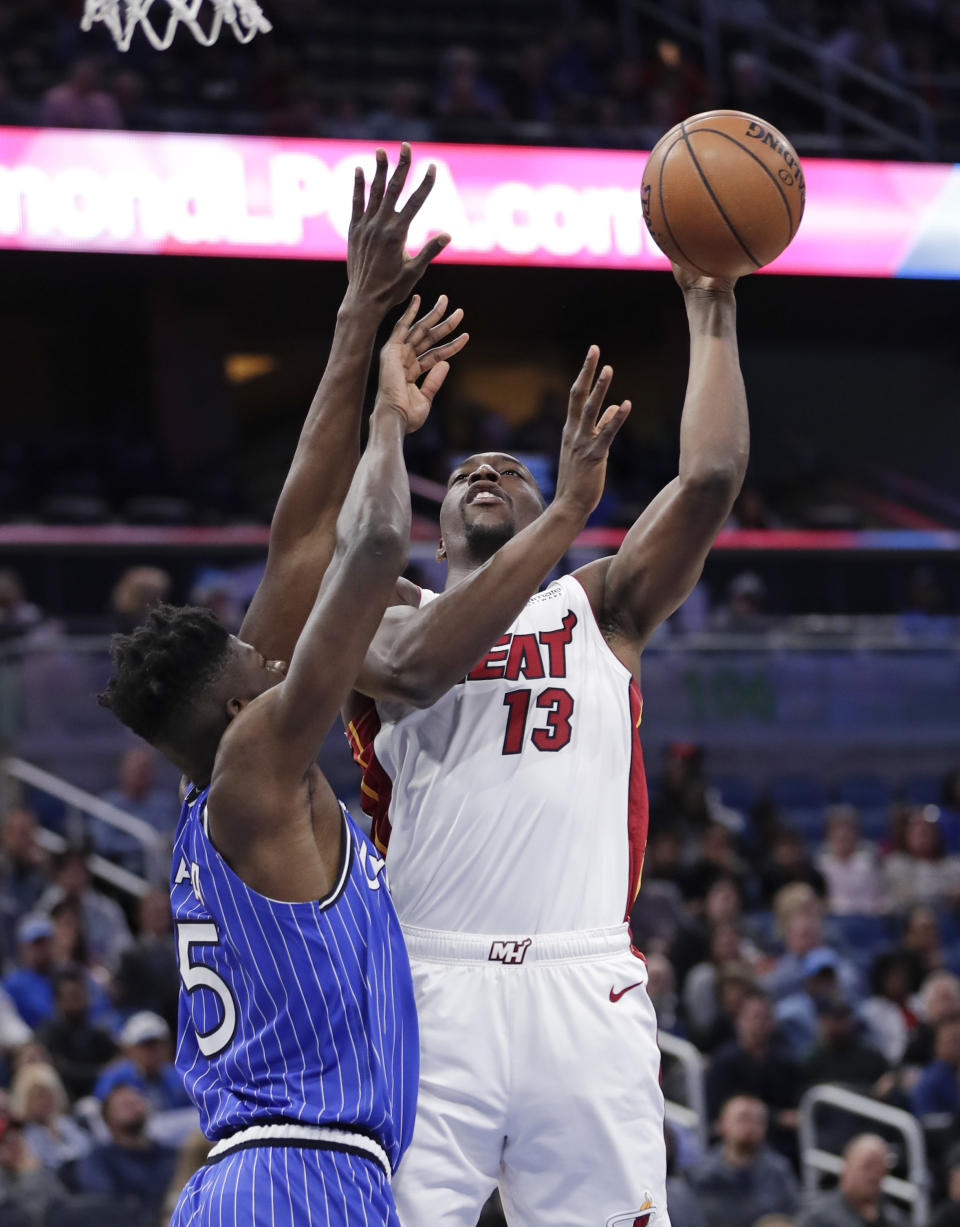Miami Heat's Bam Adebayo (13) shoots over Orlando Magic's Mo Bamba (5) during the first half of an NBA basketball game, Sunday, Dec. 23, 2018, in Orlando, Fla. (AP Photo/John Raoux)