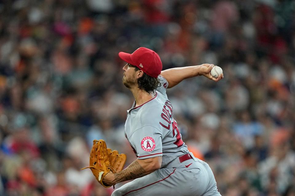 Los Angeles Angels starting pitcher Michael Lorenzen throws against the Houston Astros during the first inning of a baseball game Friday, July 1, 2022, in Houston. (AP Photo/David J. Phillip)