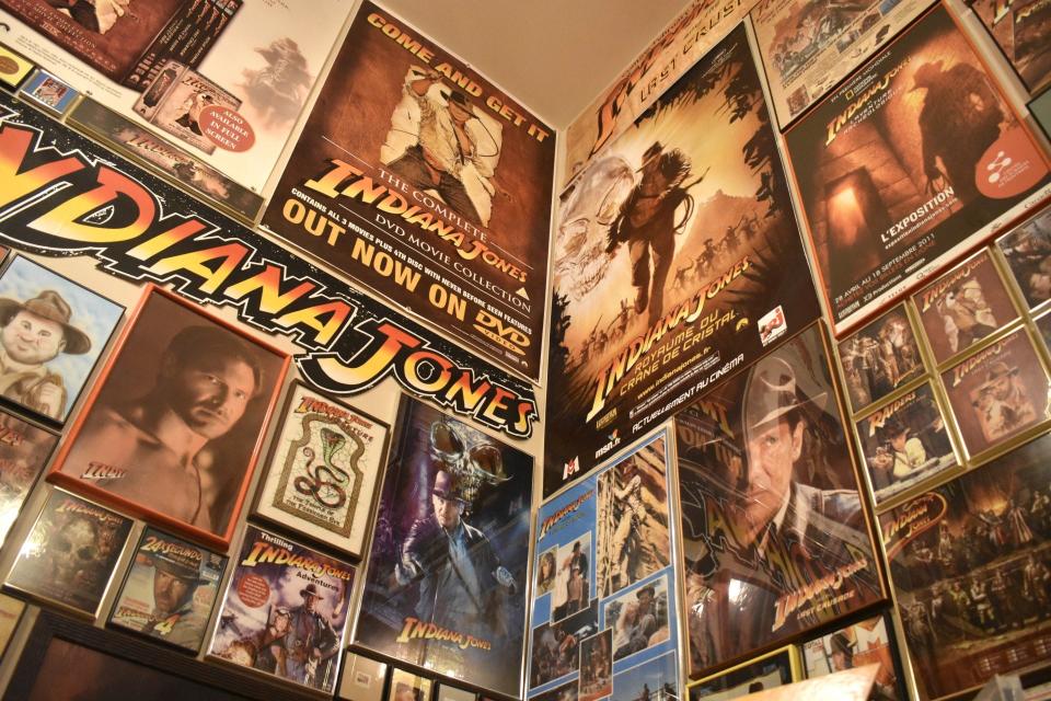"Indiana Jones" series posters and photographs cover two walls of Michael Miller's collection room, as seen, July 5, 2023 in Sheboygan, Wis.