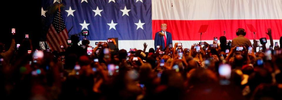 Former President Donald Trump walks onto the stage at the Columbus Convention & Trade Center Saturday afternoon during the Georgia GOP state convention. 06/10/2023 Mike Haskey/mhaskey@ledger-enquirer.com