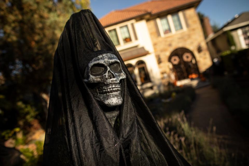 Halloween decorations are pictured at homes on Trinity Street in Vancouver, British Columbia on Monday, October 30, 2023. 