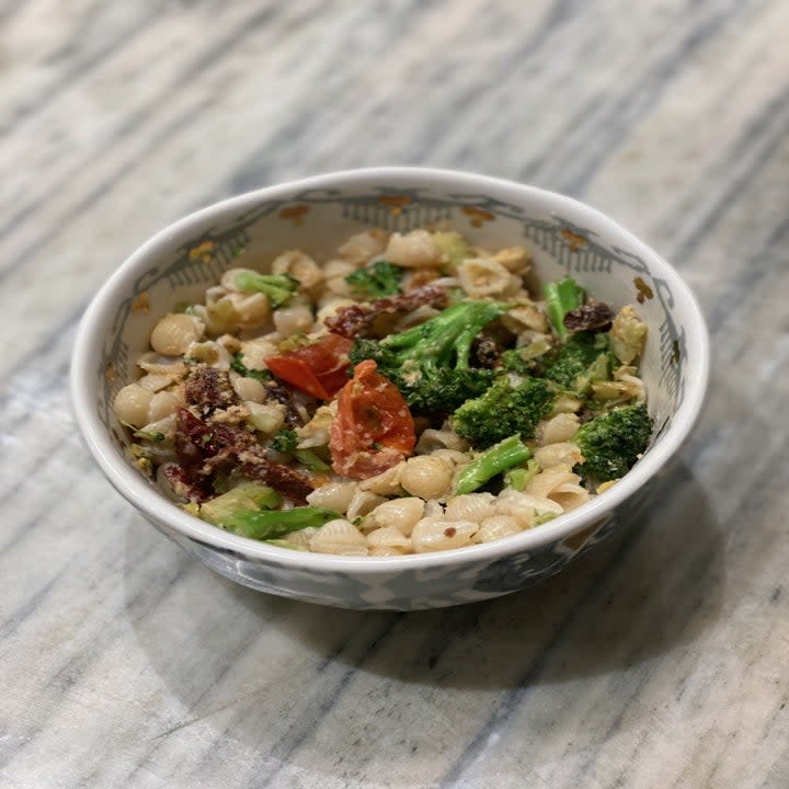 White cheddar shells with broccoli, tomatoes, and sun dried tomatoes