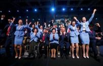 Members of the Beijing delegation celebrate after Beijing was awarded the 2022 Winter Olympic Games, defeating Almaty in the final round of voting, during the 128th IOC session in Kuala Lumpur, July 31, 2015. REUTERS/Olivia Harris