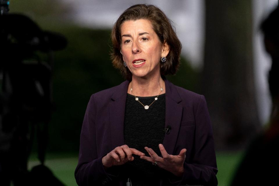 Commerce Secretary Gina Raimondo speaks during a television interview on the North Lawn of the White House, Wednesday, March 31, 2021, in Washington.