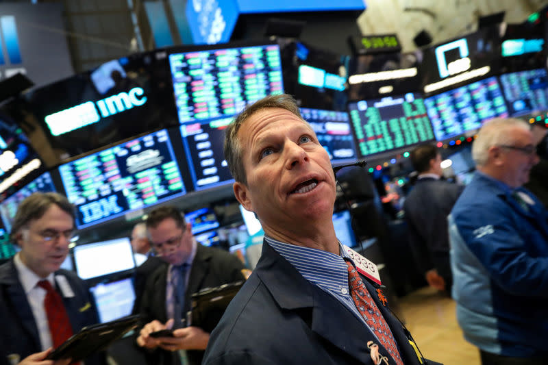 Traders work on the floor of the New York Stock Exchange (NYSE) in New York, U.S., December 11, 2018. REUTERS/Brendan McDermid