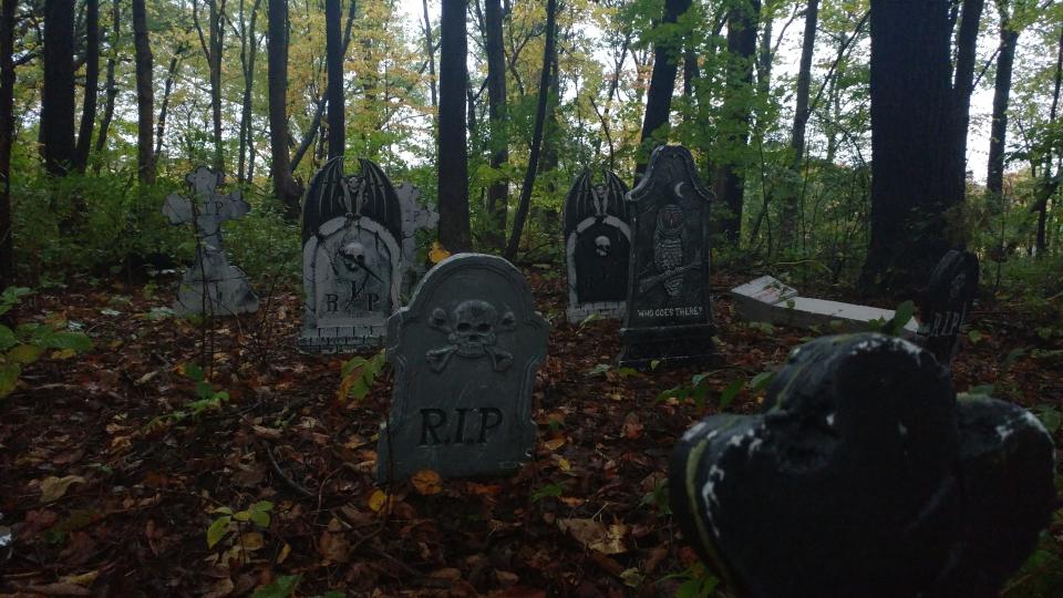 Tombstones are shown along the "Walk of the Dead" haunted trail behind Lakeside Splashzone. [Talbot Fisher/The Register-Mail]