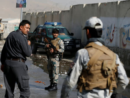 Afghan policemen keep watch at the site of a suicide attack in Kabul, Afghanistan October 29, 2018. REUTERS/Omar Sobhani