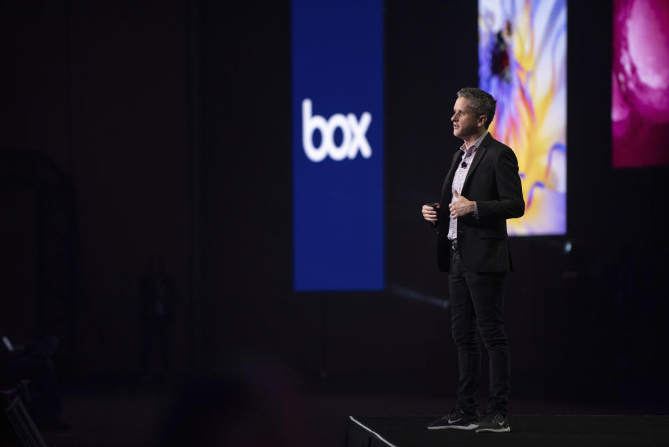 Aaron Levie CEO of Box on stage in front of Box logo.