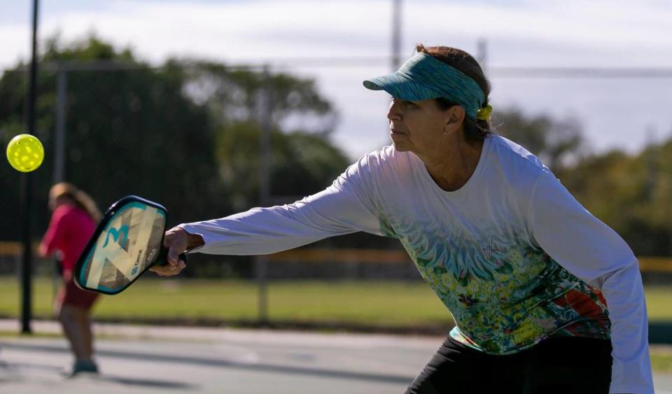 Debbie Klem, 68, plays a game of pickleball at Suniland Park in Pinecrest, Florida on Friday, January 14, 2022.