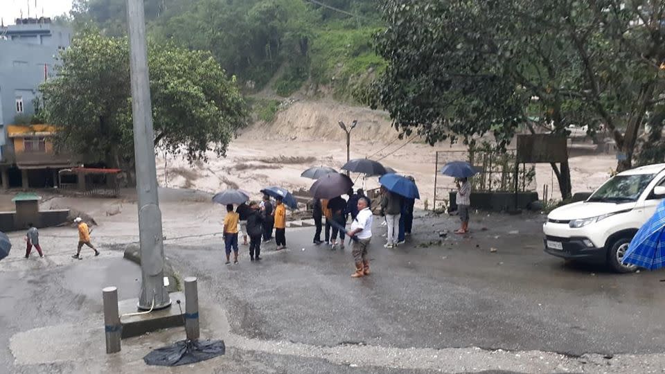 People inspect the damage from flash flooding in Sikkim, India on Wednesday, Oct. 4, 2023. - Government of Sikkim