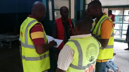 Members of the National Emergency Management Agency (NEMA) prepare to evacuate casualties from the site of blasts attack in Mubi, in northeast Nigeria May 1, 2018. NEMA/Handout via REUTERS.