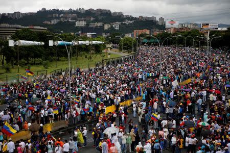 Demonstrators gather in front of a Venezuelan Air Force base while rallying against Venezuelan President Nicolas Maduro's government in Caracas, Venezuela, June 24, 2017. REUTERS/Ivan Alvarado