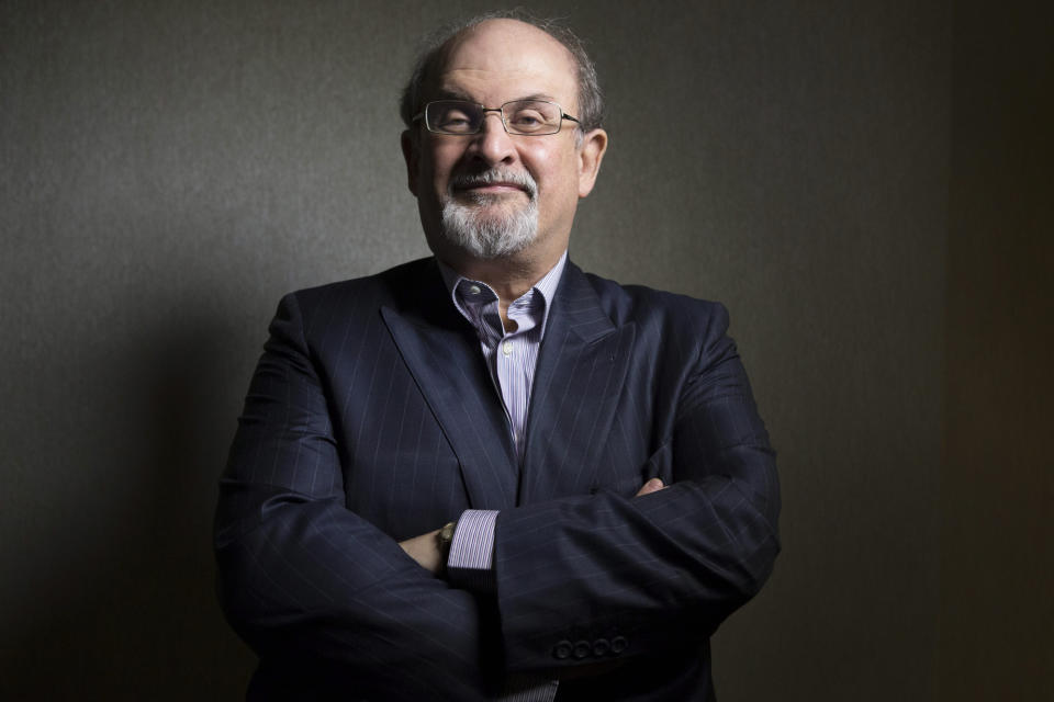 FILE - This Sept. 8, 2012 file photo shows author Salman Rushdie posing during the 2012 Toronto International Film Festival in Toronto. Rushdie is promoting the film adaptation of his breakthrough novel, "Midnight's Children," winner of the Booker Prize in 1981 and one of the most highly praised works of fiction of its time. (AP Photo/The Canadian Presss, Chris Young, file)