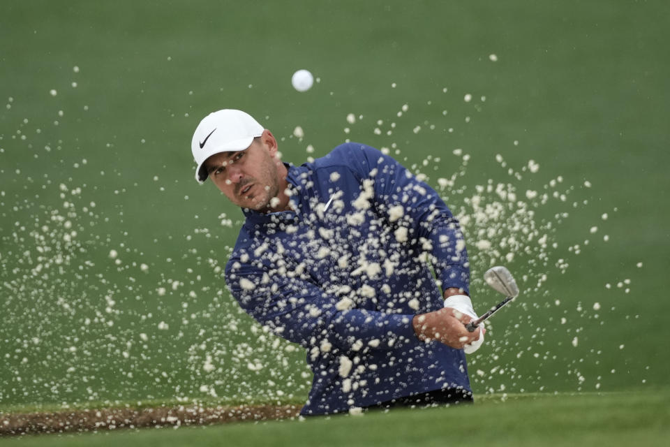 Brooks Koepka hits from the bunker on the second hole during the weather delayed third round of the Masters golf tournament at Augusta National Golf Club on Saturday, April 8, 2023, in Augusta, Ga. (AP Photo/David J. Phillip)