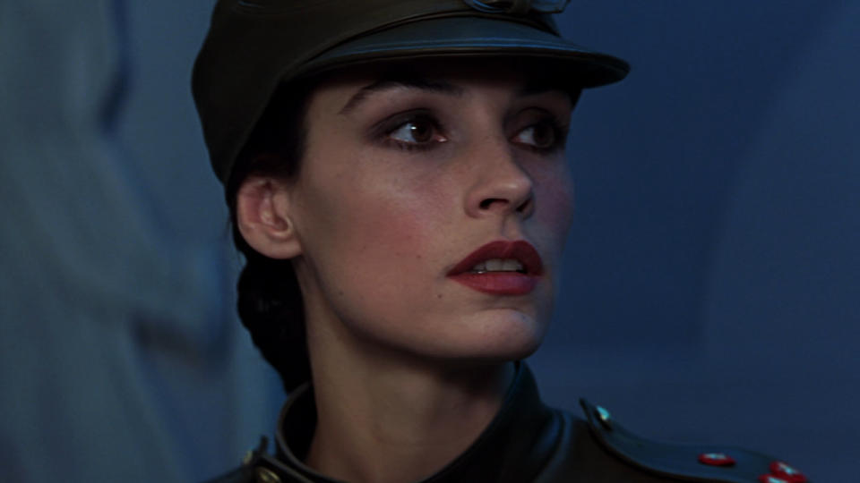 Famke Janssen poses in a uniformed disguise in Goldeneye.