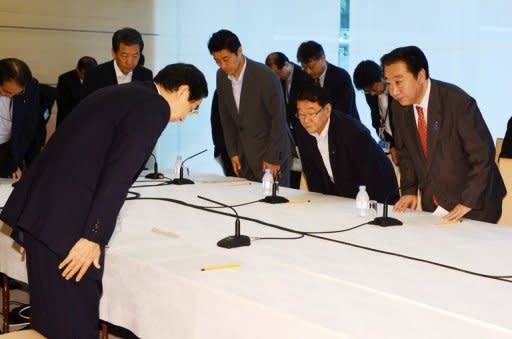 Japanese Prime Minister Yoshihiko Noda (R) greets Fukui Governor Issei Nishikawa (L) at his official residence in Tokyo on June 16. Noda ordered nuclear reactors back online on Saturday, defying public sentiment against atomic power following the quake-tsunami that sparked last year's meltdowns at Fukushima
