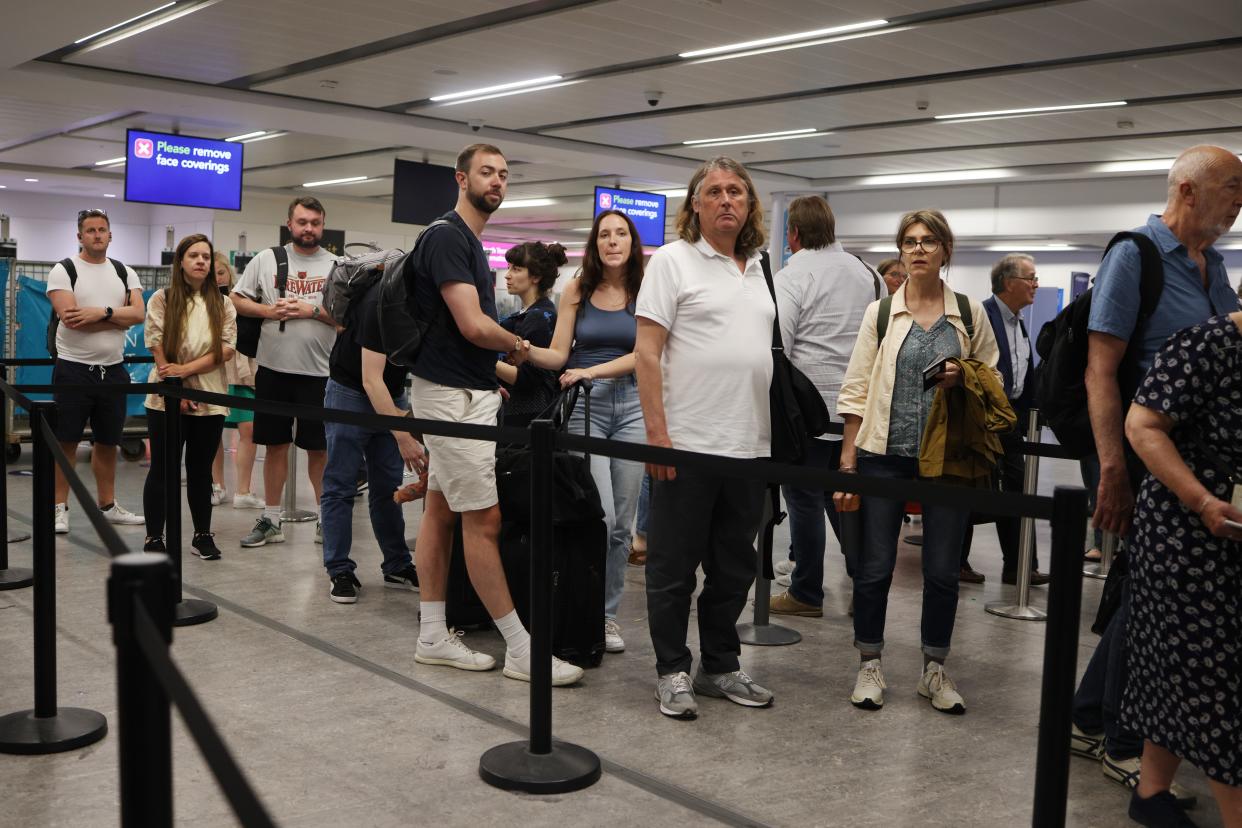 Passengers queue at Gatwick Airport as electronic passport gates fail across the UK on May 27, 2023 (Getty Images)