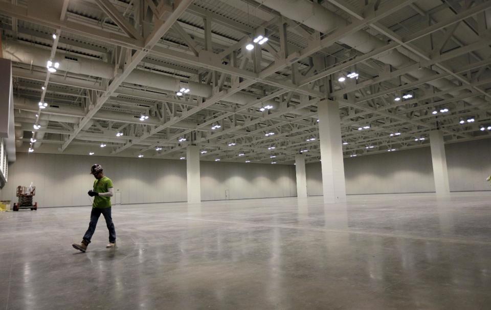 This April 12, 2013, photo shows part of the eight-acre exhibit hall space in the Music City Center in Nashville, Tenn. Nashville's new convention center is transforming the look of downtown with its wavy roof dominating six city blocks, but tourism officials hope the eye-catching facility will also show business travelers a revitalized Music City. (A P Photo/Mark Humphrey)