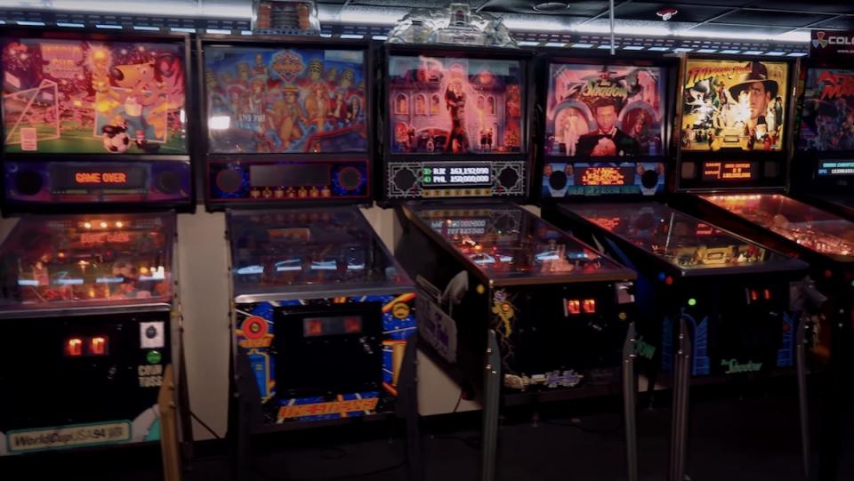 A series of pinball machines lined up at the Museum of Pinball