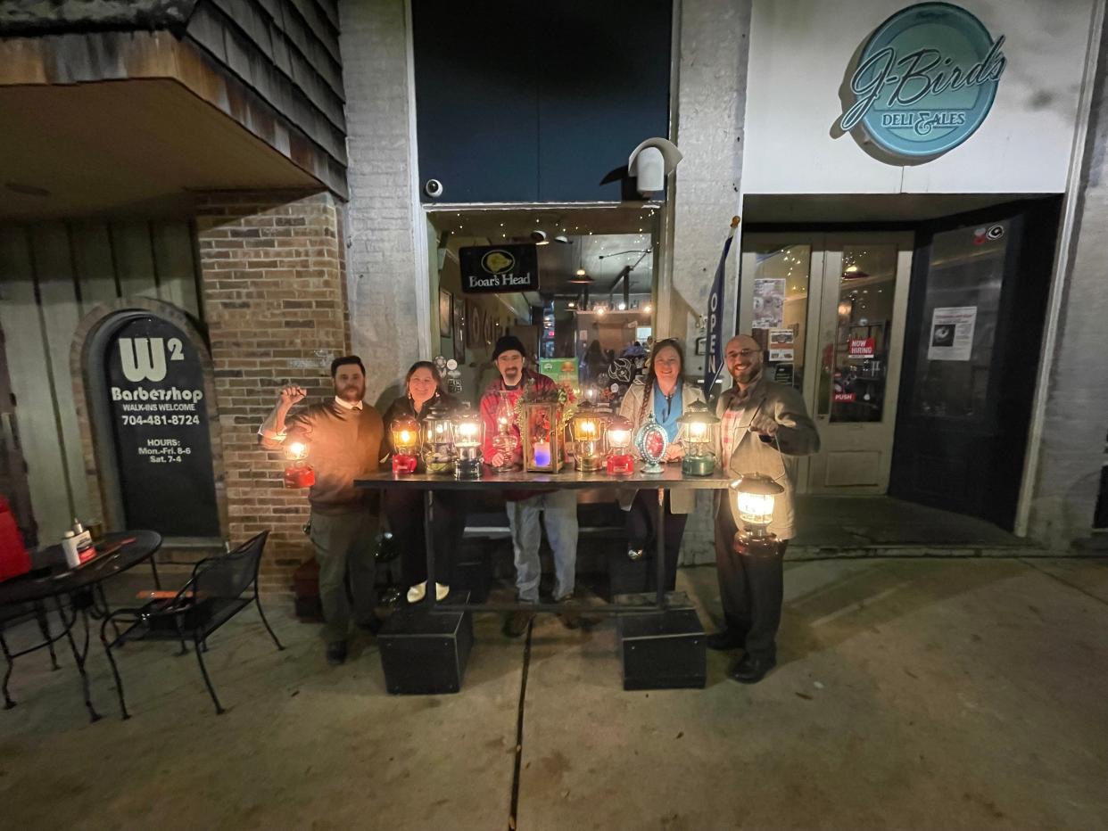 Brian Clark, Julie Clark, Rodger Perry, Maria Padgett and Jonathan Davis all gather at J-Bird's on Thursday evenings and work on old lanterns.