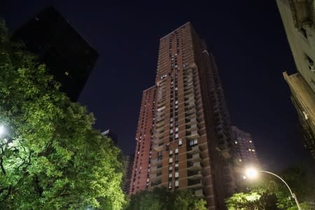 A residential building light out near Times Square area, as a blackout affects buildings and traffic during widespread power outages in the Manhattan borough of New York