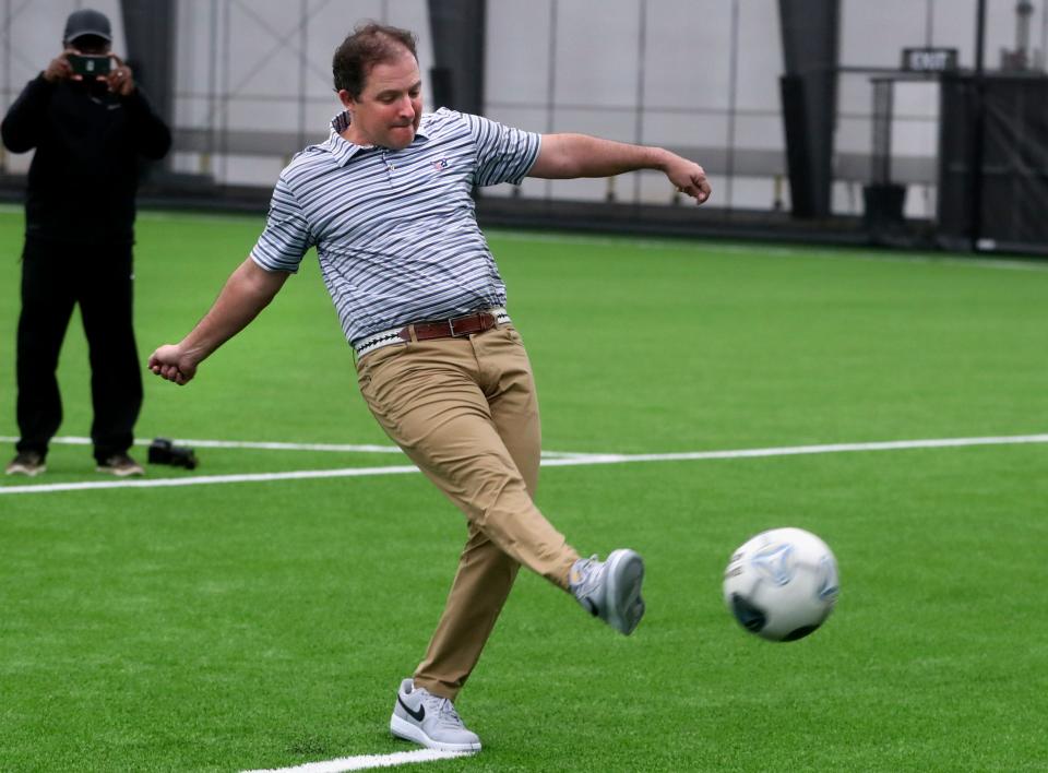 Murfreesboro Mayor Shane McFarland attempts a soccer goal after the ribbon-cutting ceremony for the Siegel Soccer Park's indoor training field on Friday, March 24, 2023.