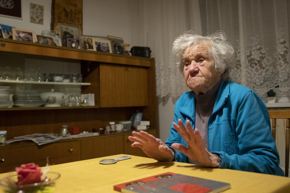 In this photo taken Friday, Jan. 24, 2020, Nazi camps survivor Marija Frlan, who will turn 100 on the Holocaust Remembrance day, talks to the Associated Press during an interview at her home in Rakek, Slovenia. Frlan, who was held at the Ravensbruck camp in northern Germany for over a year in 1944-45, will join other survivors and officials in Poland on Monday for the ceremonies marking the 75th anniversary of the liberation of the Auschwitz camp. (AP Photo/Darko Bandic)