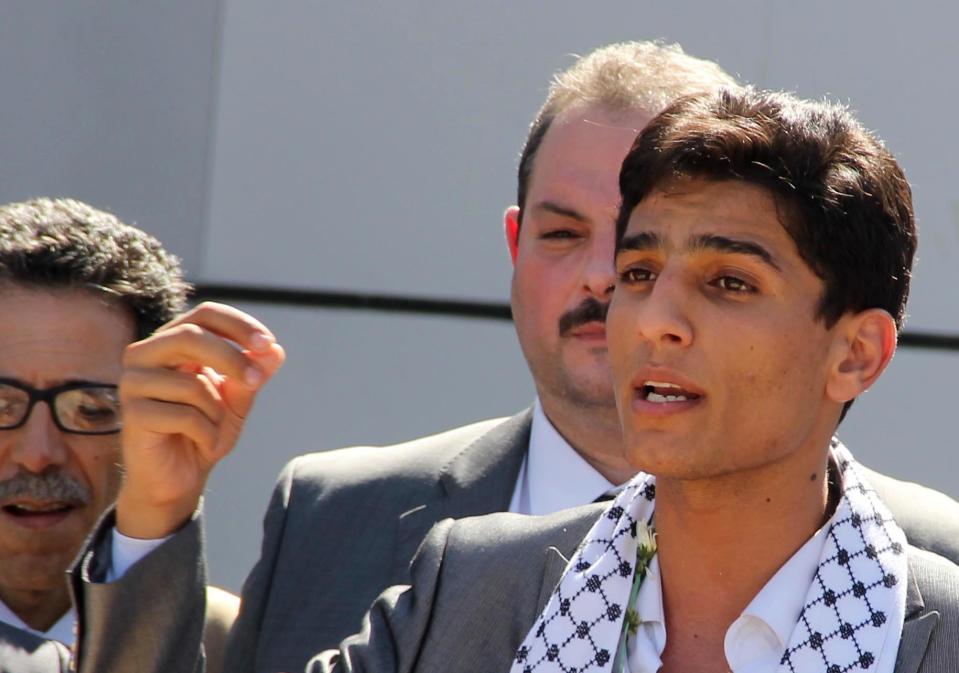 Arab Idol winner Palestinian Mohammed Assaf speaks upon arrival at the Rafah crossing point on the border between Egypt and southern Gaza Strip, Tuesday, June 25, 2013. Huge crowds of Gazans gave a gleeful welcome Tuesday to the first Palestinian winner of the Arab Idol talent contest, thronging the territory's border crossing with Egypt and the singer's home in hopes of embracing him, but internal politics surfaced quickly. Assaf’s victory in the popular contest Saturday sparked huge celebrations in the West Bank and Gaza, giving Palestinians a sense of pride. (AP Photo/Khaled Omar, Pool)