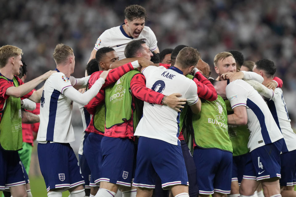 England players celebrate at the end of a semifinal match between the Netherlands and England at the Euro 2024 soccer tournament in Dortmund, Germany, Wednesday, July 10, 2024. England won 2-1. (AP Photo/Martin Meissner)