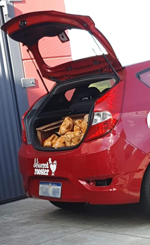 Photo of what appears to be a pile of cooked chickens in the back of an employee’s boot. Source: Facebook