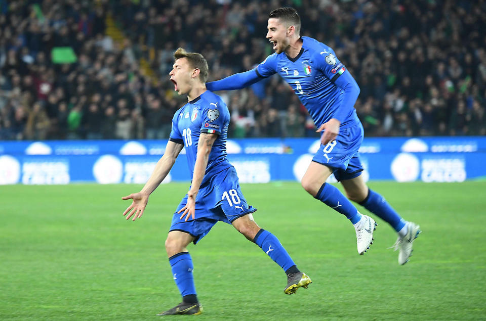 Italy's Nicolo Barella, left, celebrates with his teammate Jorginho after scoring his side's first goal during the Euro 2020 Group J qualifying soccer match between Italy and Finland at the Friuli-Dacia Arena stadium in Udine, Italy, Saturday, March 23, 2019. (Alberto Lancia/ANSA via AP)