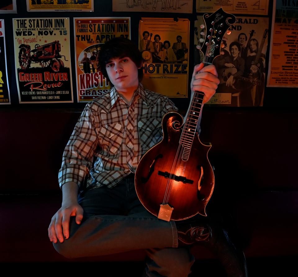 Mandolin prodigy Wyatt Ellis poses last month at the Station Inn in Nashville.