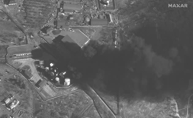 This satellite image shows fires at the fuel storage area at Antonov Airport in Hostomel, Ukraine on Thursday. (Photo: Maxar Technologies via Associated Press)