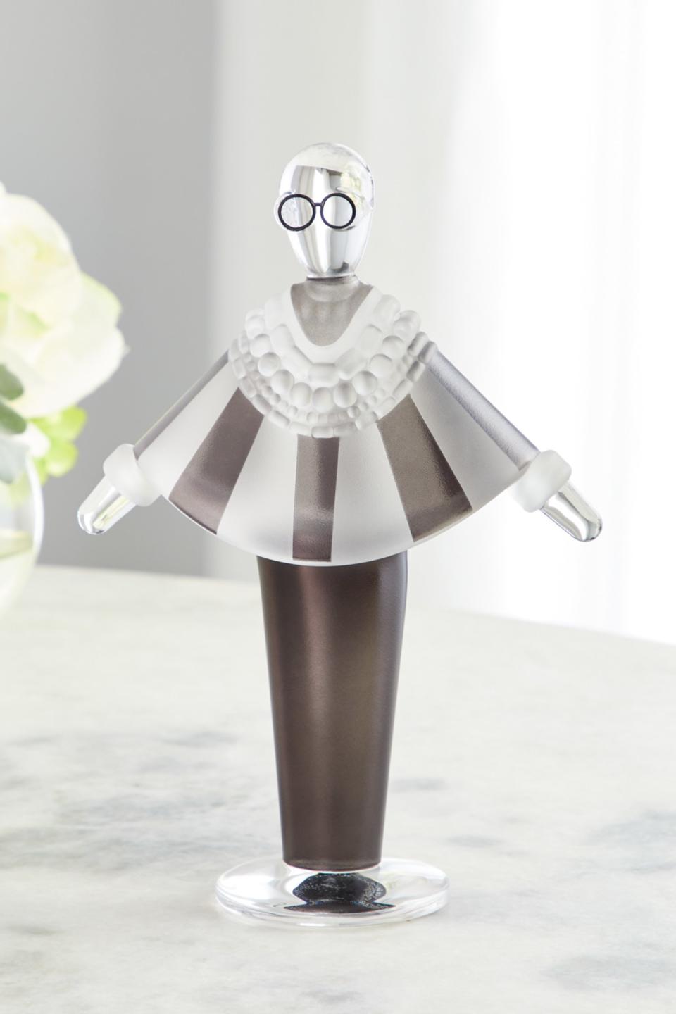 A figure of Apfel from her new Nude Glass Neiman Marcus collection.