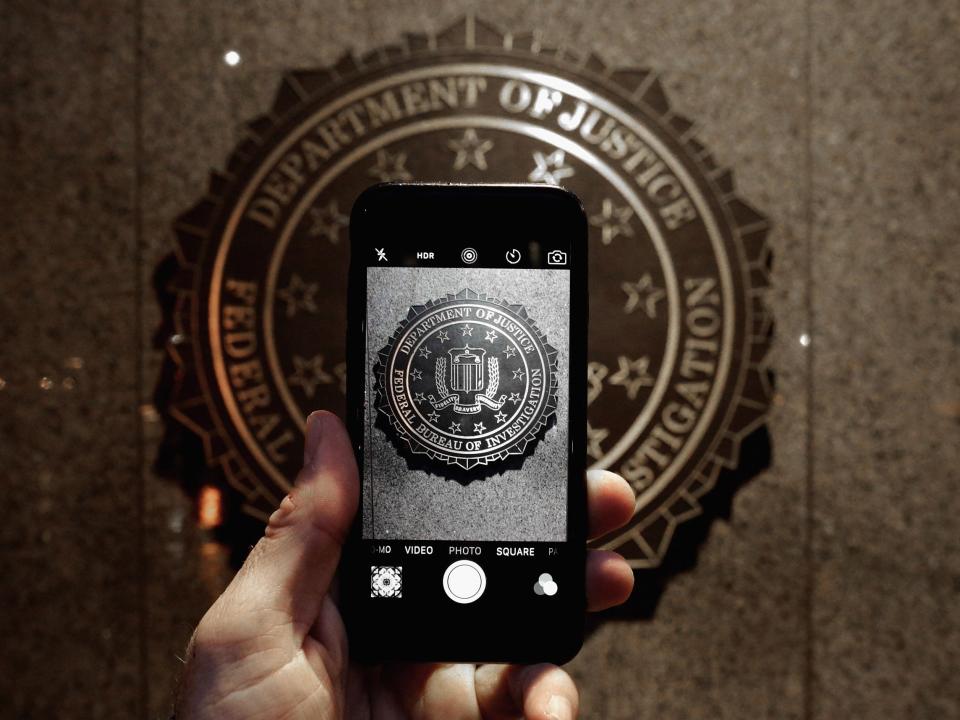The FBI logo is seen through an iPhone camera at the bureau's headquarters in Washington, D.C: Chip Somodevilla/Getty Images