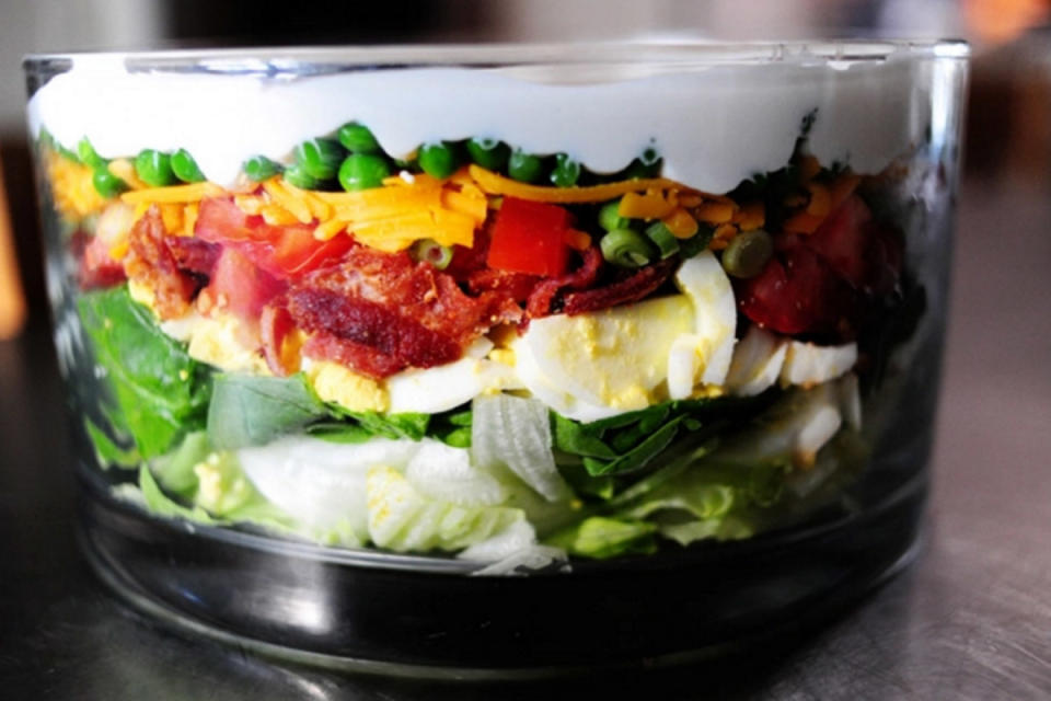 <p>Lori Lange</p><p>This type of salad is a potluck classic. The tasty ingredients are layered in a pretty glass bowl so the layers can be seen in all their colorful beauty.</p><p><strong>Recipe here:</strong> <strong><a href="http://thepioneerwoman.com/cooking/layered-salad/" rel="nofollow noopener" target="_blank" data-ylk="slk:Layered Salad;elm:context_link;itc:0;sec:content-canvas" class="link ">Layered Salad</a></strong></p>