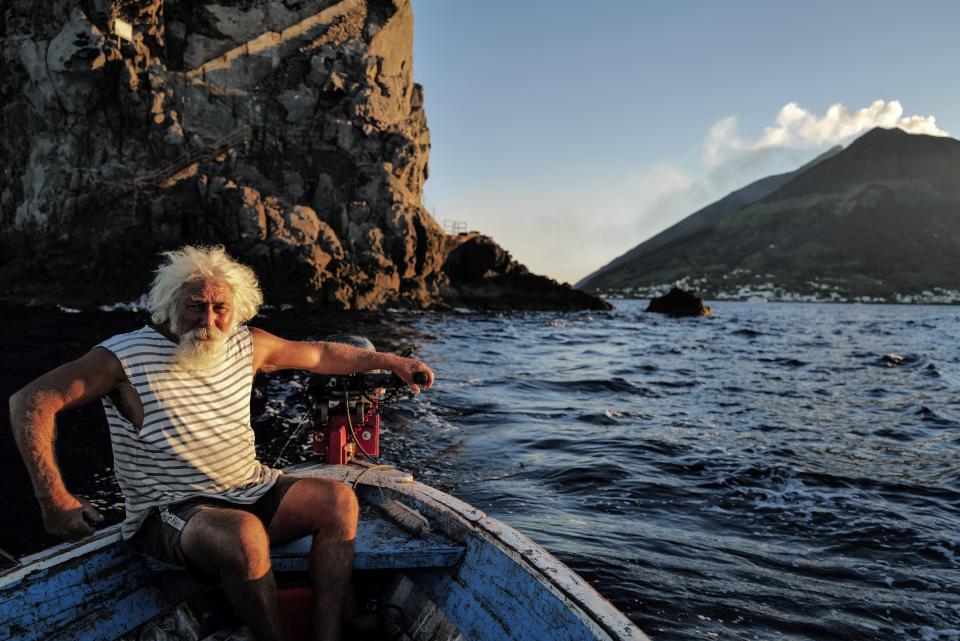 Fisherman Gaetano Cusolito, 70, sails on his boat near the Stromboli, on september 12, 2022.
