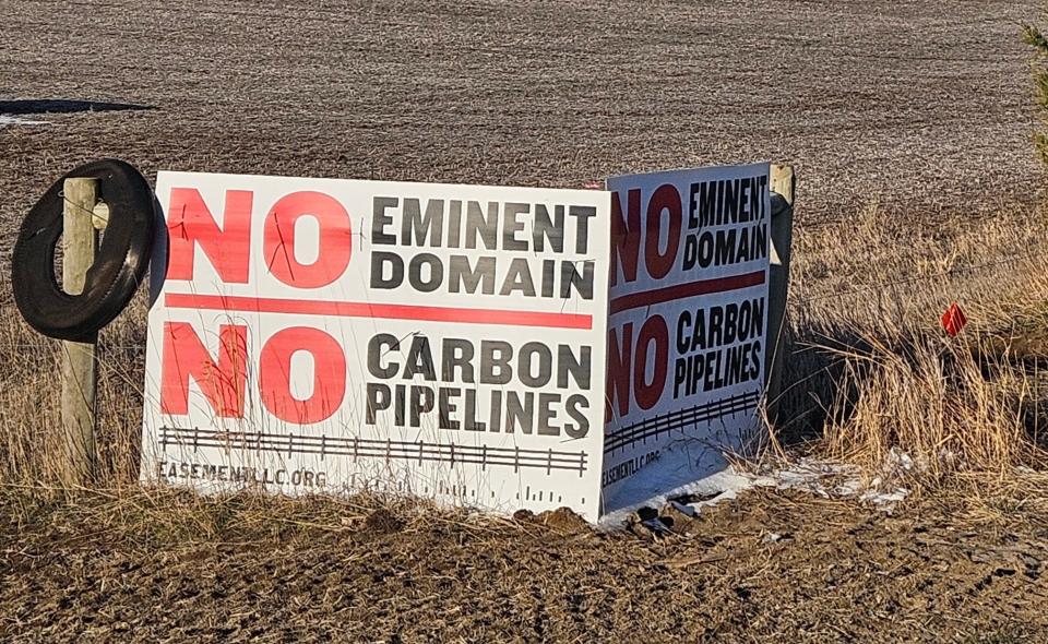 A sign against the use of eminent domain and carbon pipelines sits at the edge of a property Thursday, March 28, 2024, in Harrisburg.