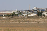 FILE PHOTO: A view of Syrian border checkpoint near Nasib border crossing between Jordan and Syria, as seen from Marafaq, Jordan, September 29, 2018. REUTERS/Muhammad Hamed/File Photo