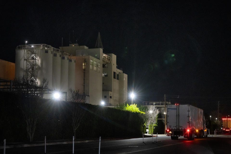 A transport truck waits outside of the Anheuser Busch factory in the Van Nuys section of Los Angeles on Wednesday, Feb. 28, 2024. A standoff between brewery workers and Anheuser-Busch might lead to the first strike by the company's unionized employees in the U.S. since 1976. But fans of Budweiser, Bud Light, Michelob and other beers don't need to worry about going dry. (AP Photo/Richard Vogel)