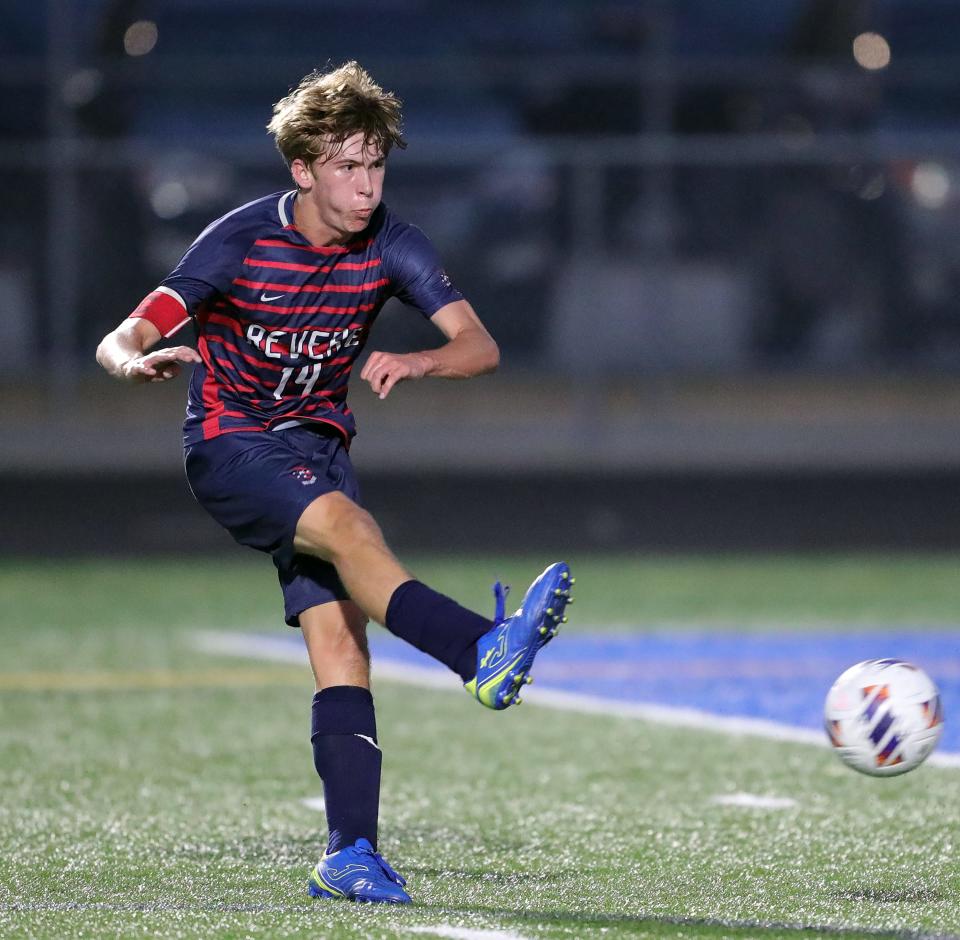 Revere's AJ Catlett takes a shot during the first half of a high school soccer game against Copley.