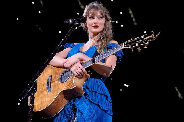 <p>Kevin Winter/TAS23/Getty</p> Taylor Swift in blue on The Eras Tour in L.A.