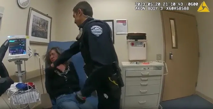 Officer Russell Maranto was fired by Loveland Police Department on May 23 after striking a woman he and another officer took to the hospital for help. This screen capture from a video released by LPD shows the use of force in question.