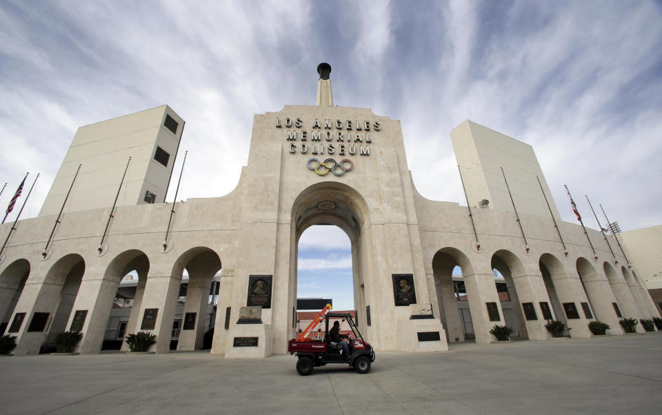 FILE - This Jan. 13, 2016 file photo shows the peristyle of the Los Angeles Memorial Coliseum in Los Angeles. The University of Southern California's sale of naming rights for Los Angeles Memorial Coliseum is being criticized as dishonoring the historic stadium's dedication as a memorial to soldiers who fought and died in World War I. USC announced last year that the stadium will be renamed United Airlines Memorial Coliseum as part of a $270 million renovation of the facility, which opened in 1923. (AP Photo/Nick Ut, File)